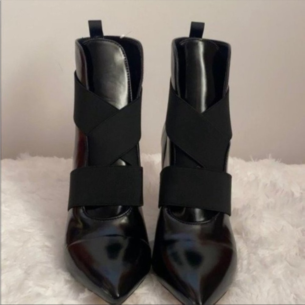 Black strapped boots heels